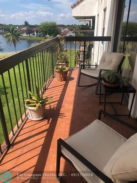 a view of balcony with furniture