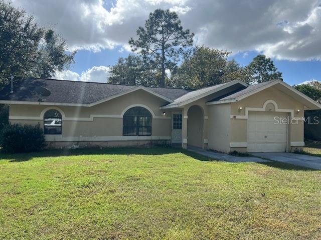 a front view of a house with yard