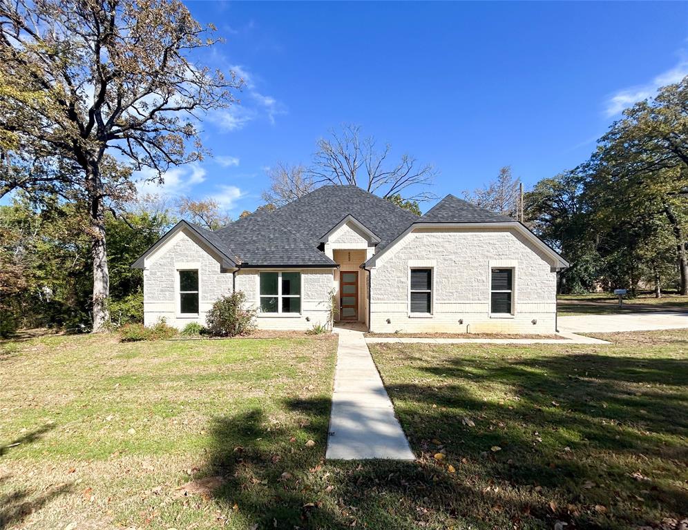 a front view of a house with a yard