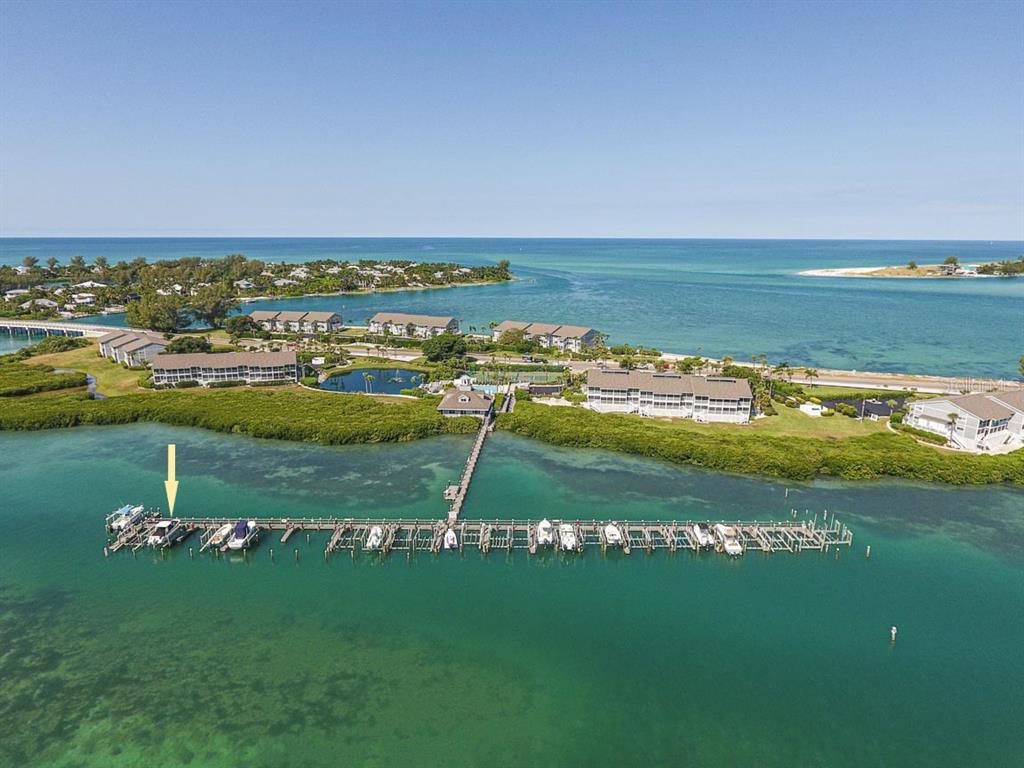 a view of a golf course with an ocean