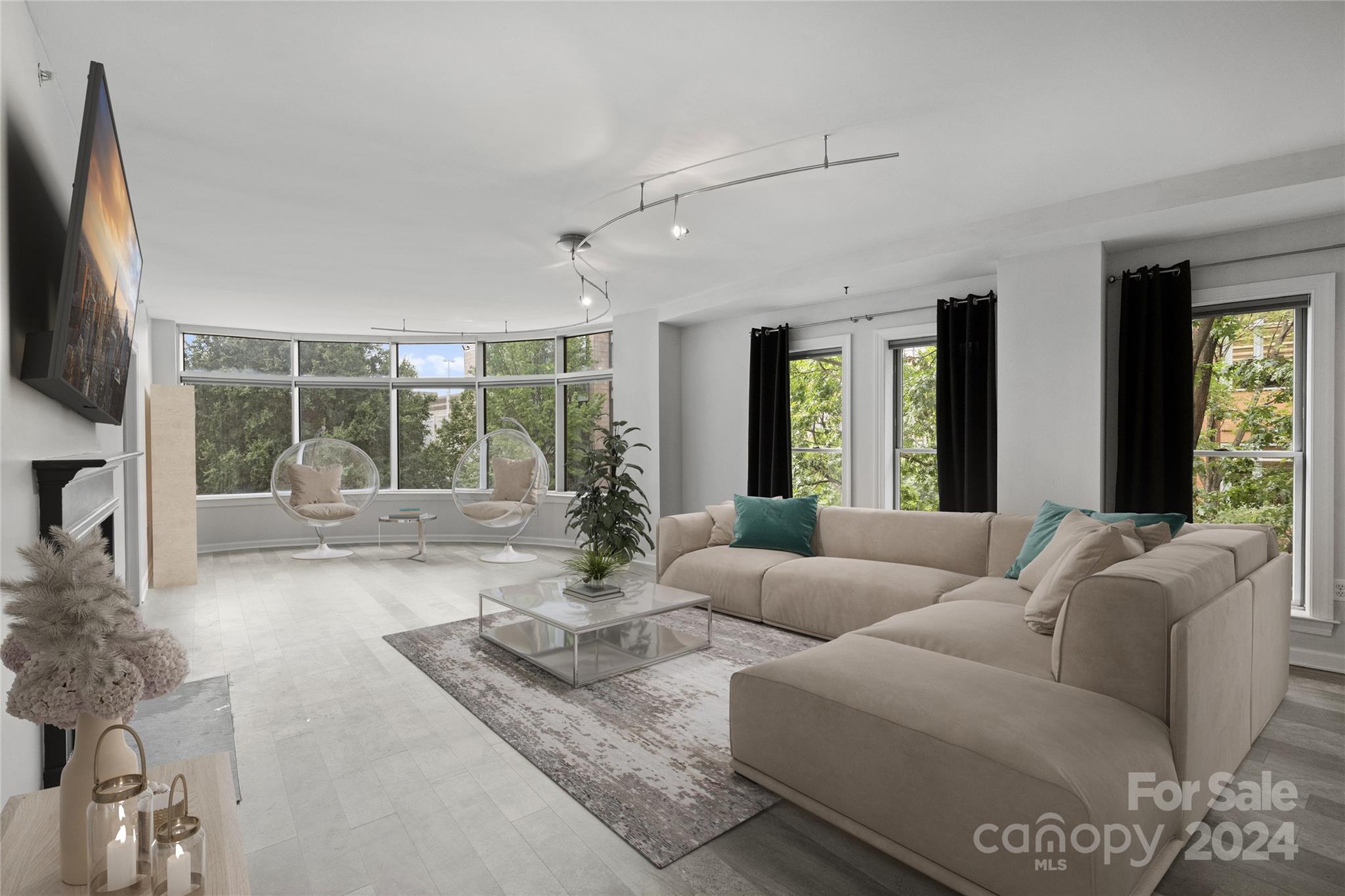 a living room with furniture and a flat screen tv