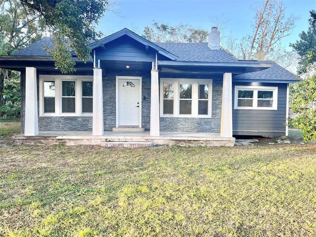 front view of a house with a yard