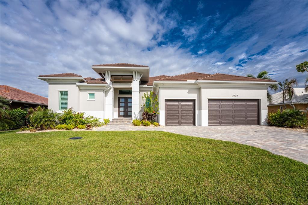 front view of a house with a yard