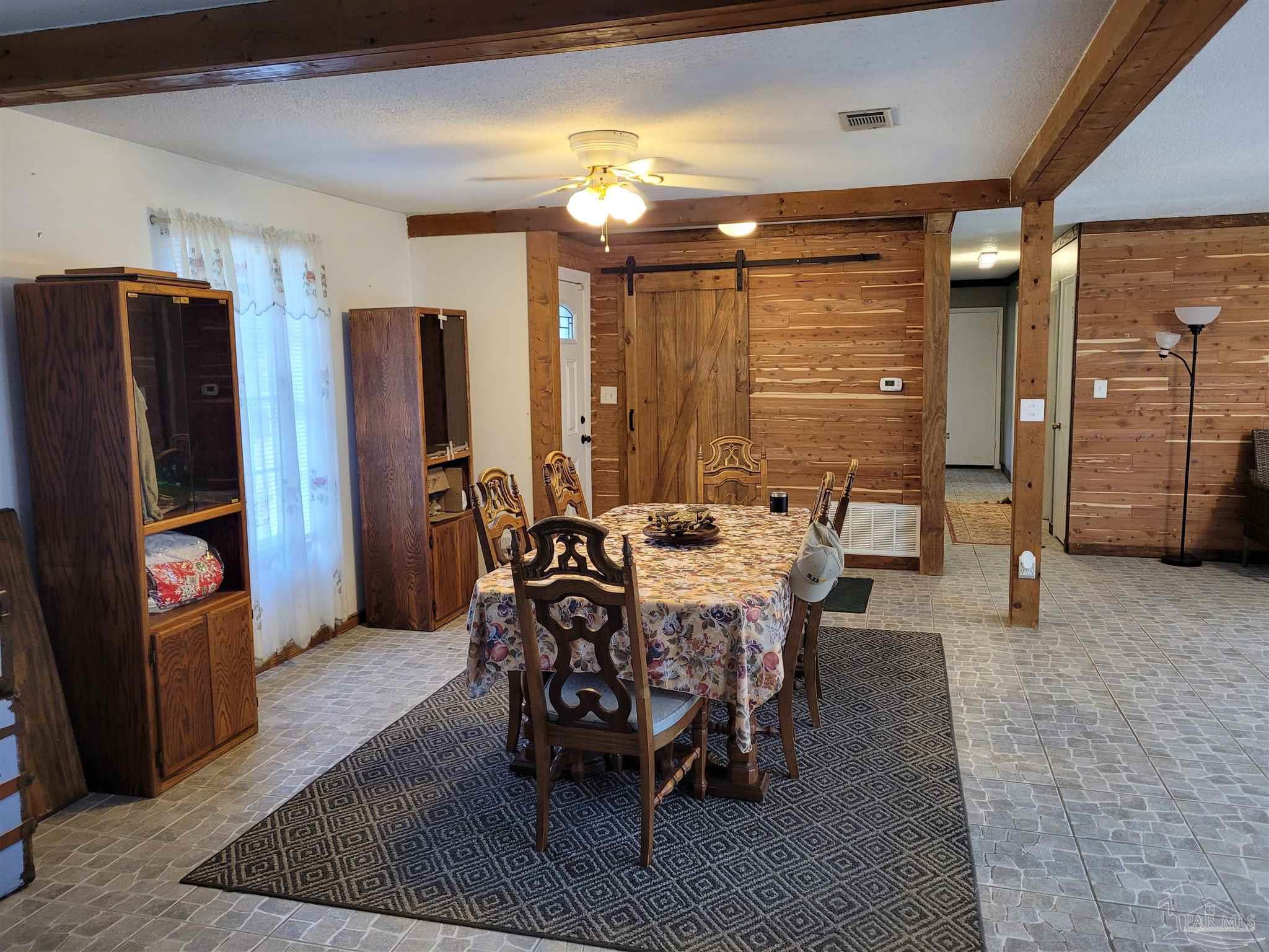 a view of a dining room with furniture