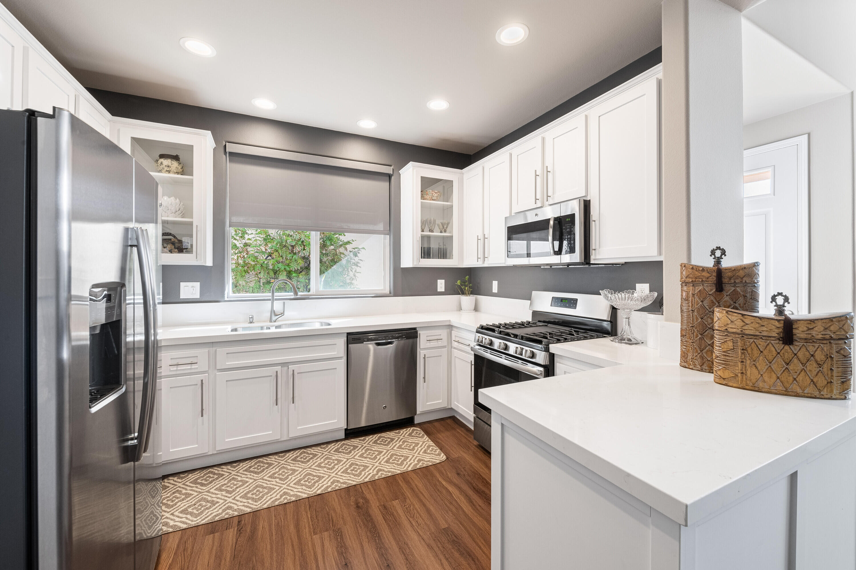 a kitchen with a stove a sink and a refrigerator