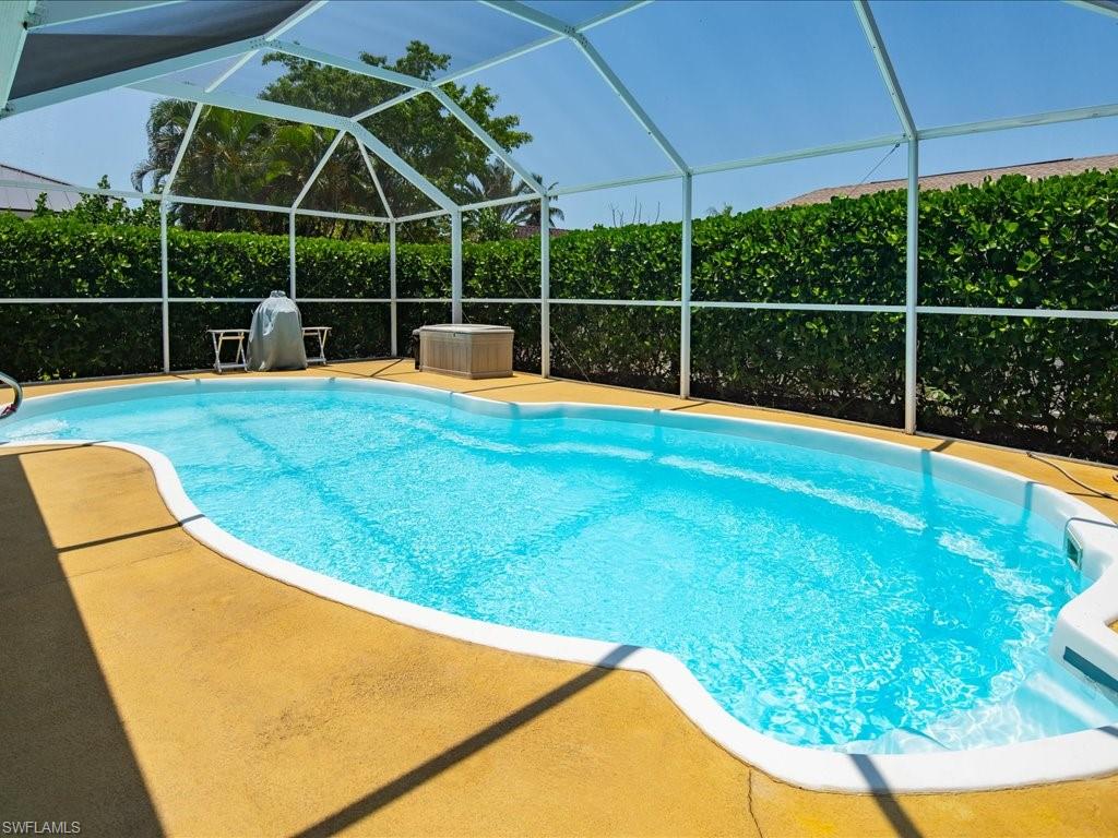 a view of a backyard with swimming pool