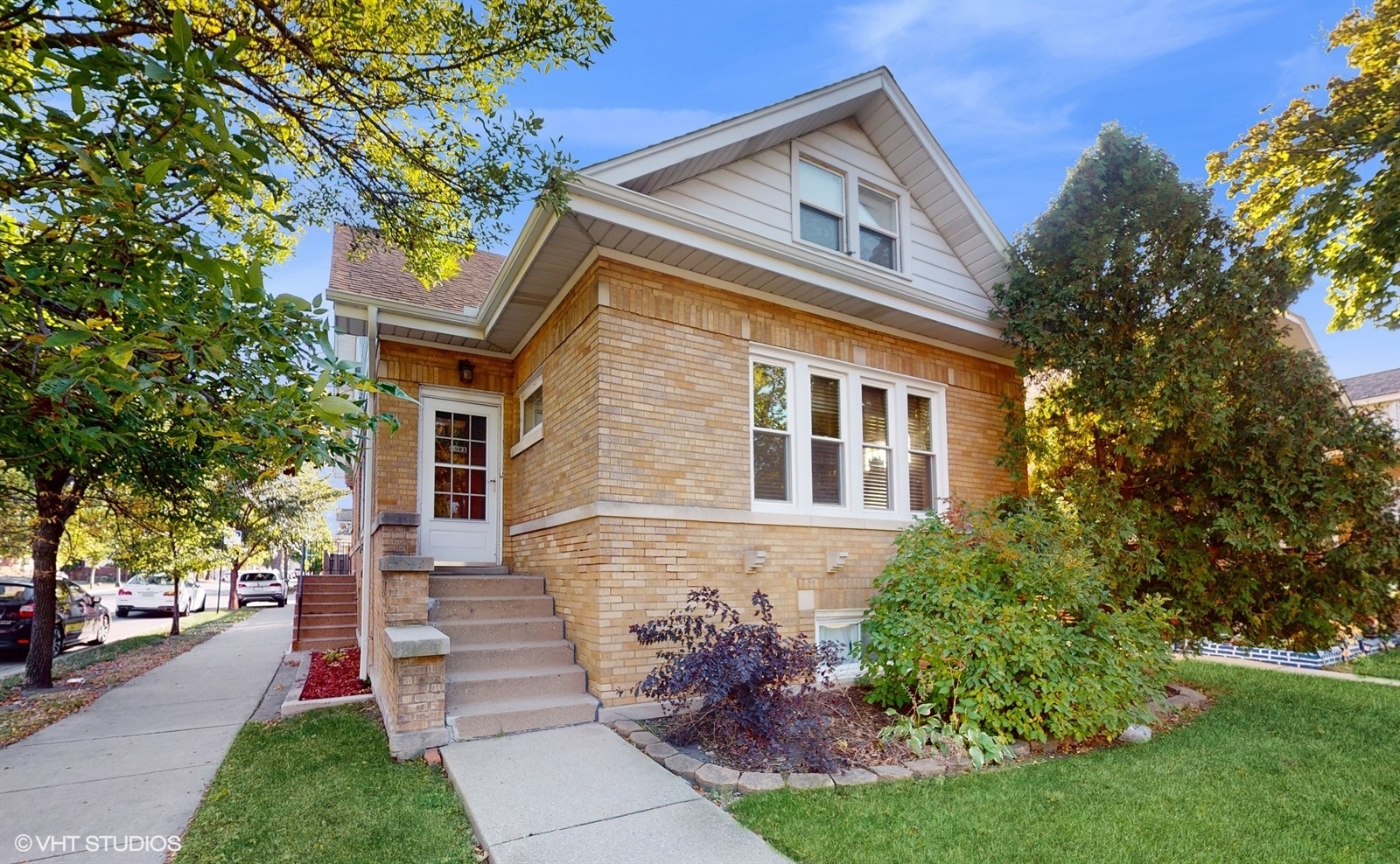 a front view of a house with a yard