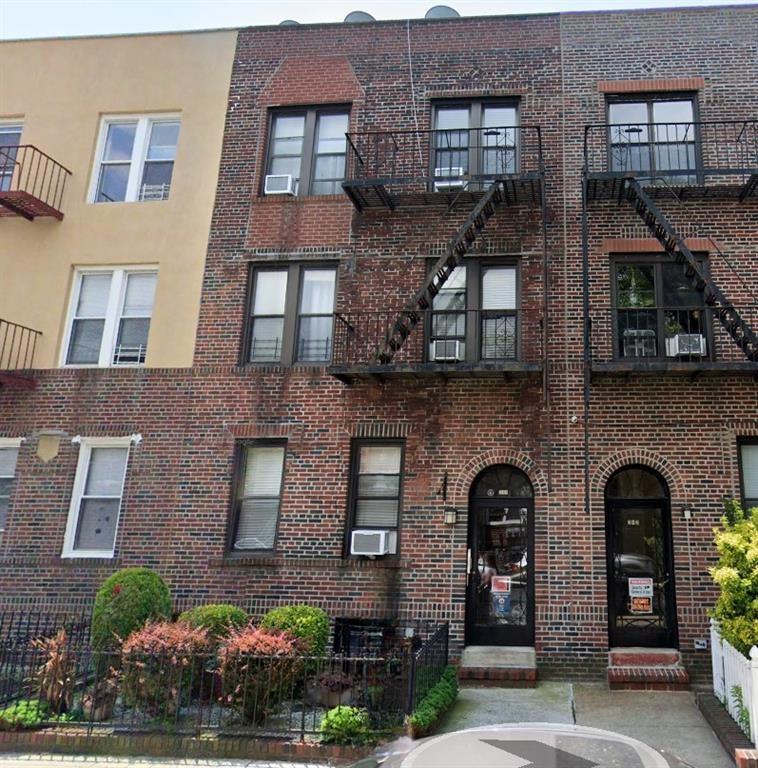 a front view of a building with a lot of windows