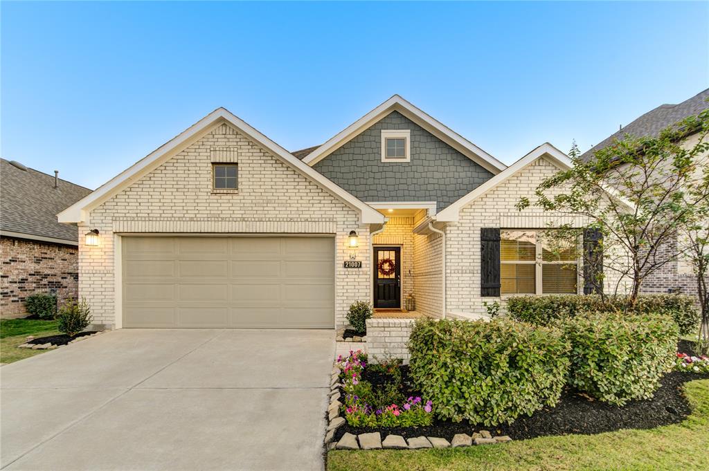 Beautifully crafted recently constructed one-story home on an expansive lot in the sought-after Bridgeland community. The modern facade features a blend of brick and stone, with meticulous landscaping and a welcoming covered entryway.