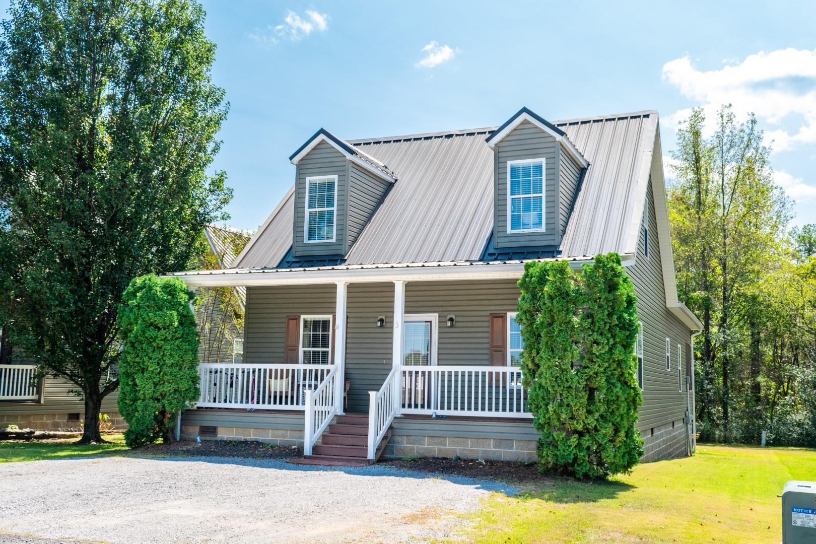 a view of a house with a yard and plants