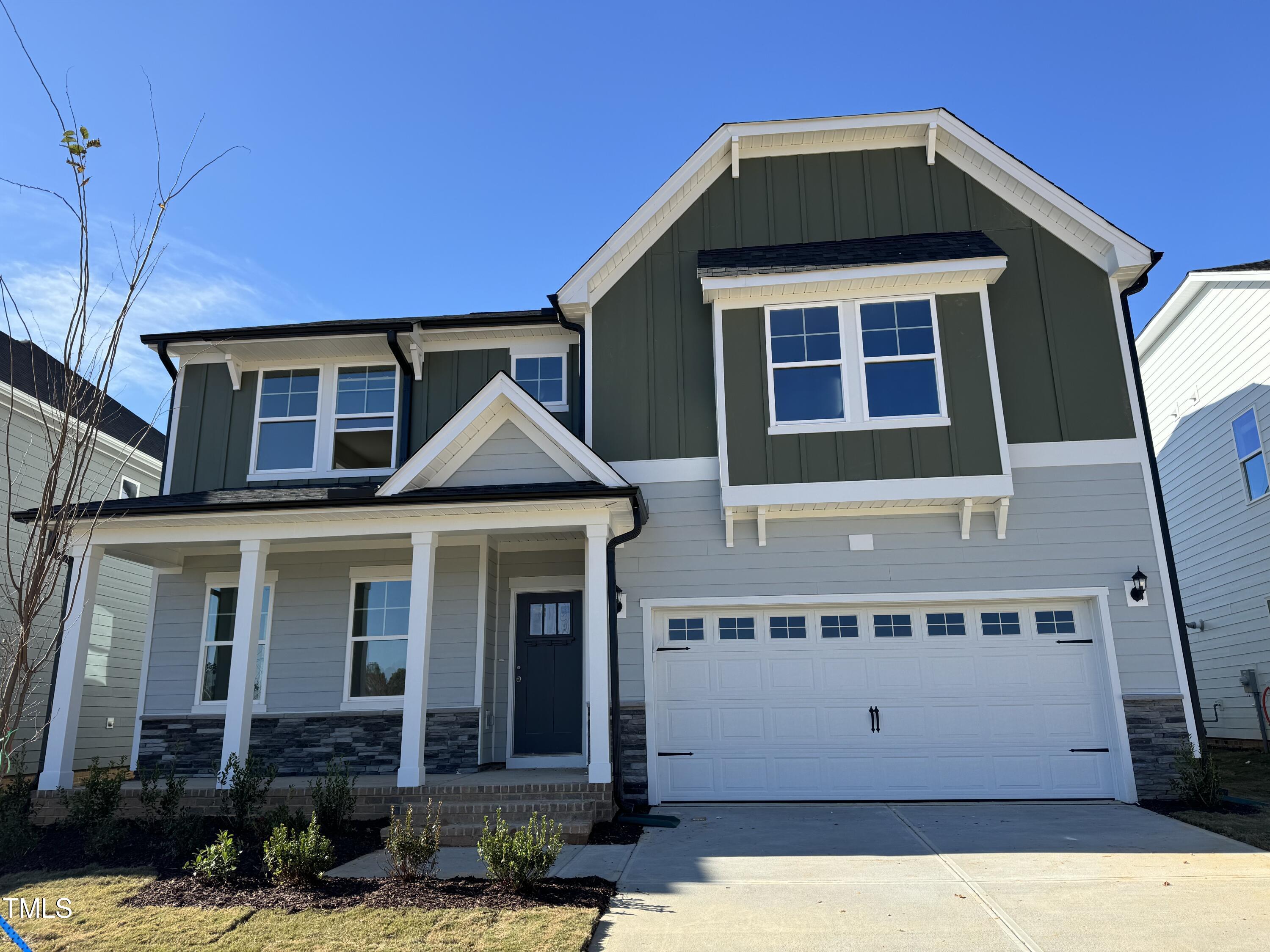 a front view of a house with garage