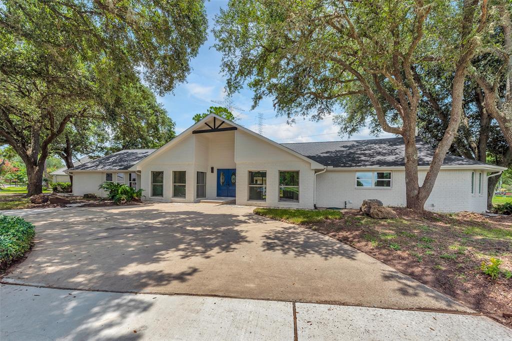 Welcome home! This gorgeous 4 bedroom, 5 bath fully renovated custom home is the one! The front offers a serene curved driveway for an inviting front entrancce.