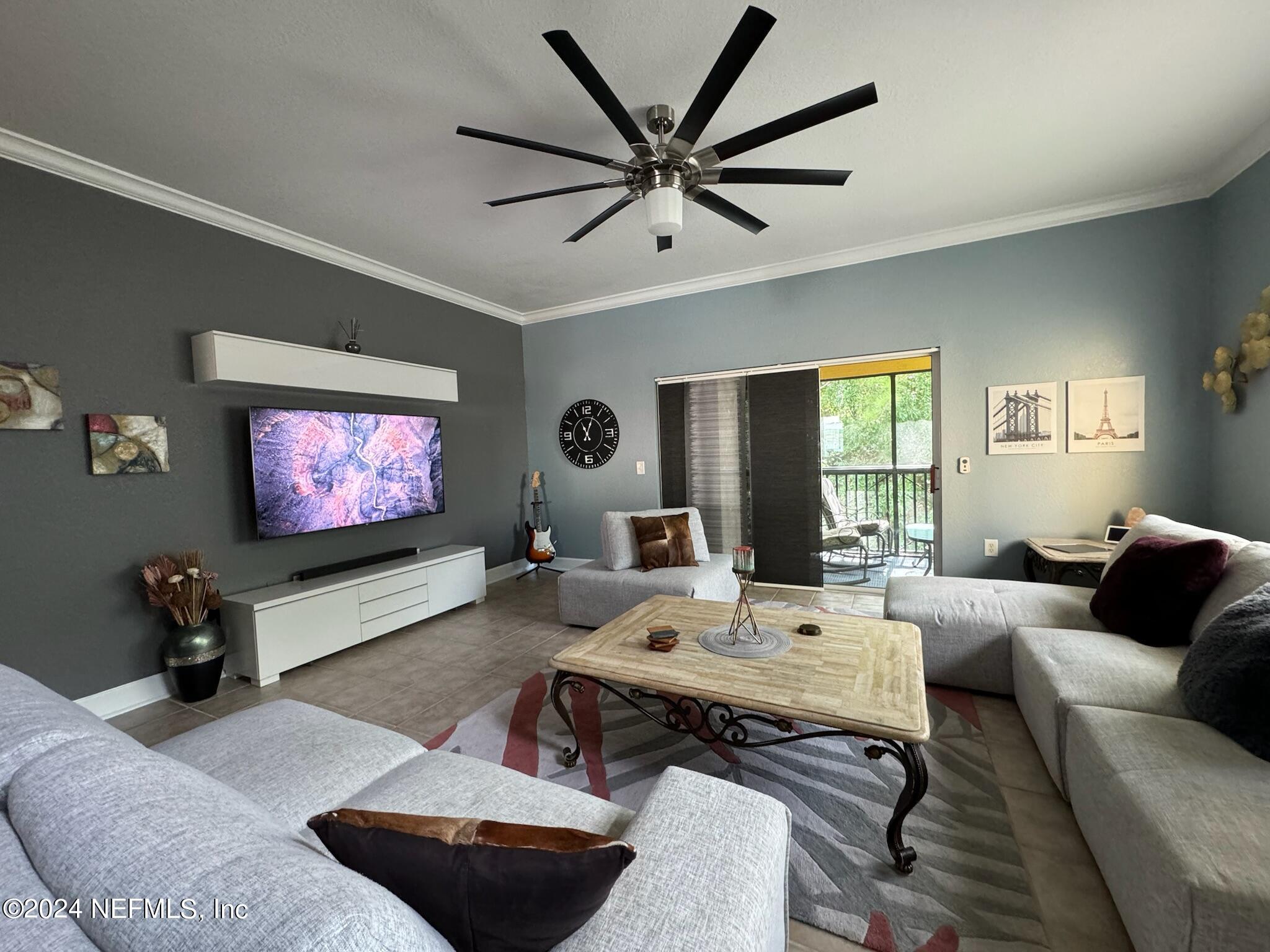 a living room with furniture and a flat screen tv