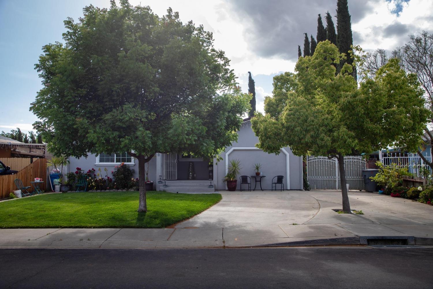 a house with tree in front of it