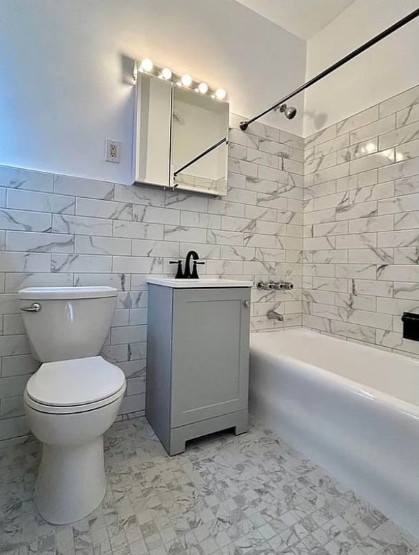 a bathroom with a sink toilet and bathtub