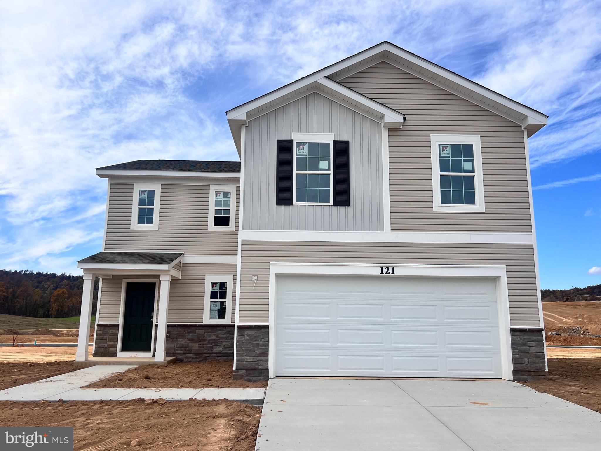 a front view of a house with a garage