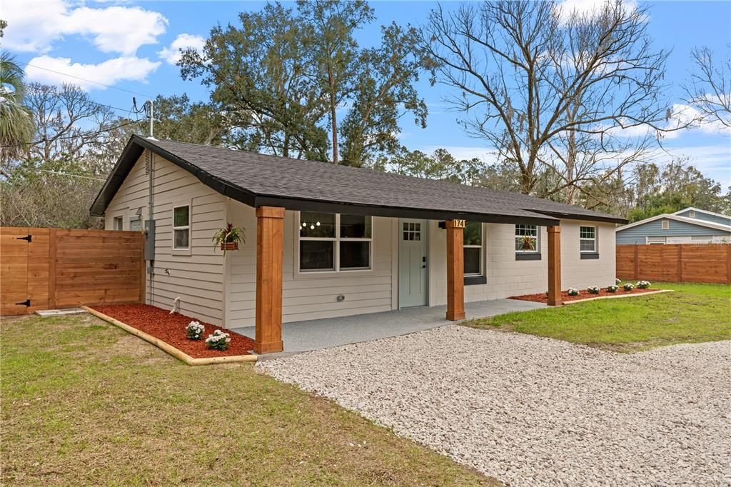 a view of a house with a yard