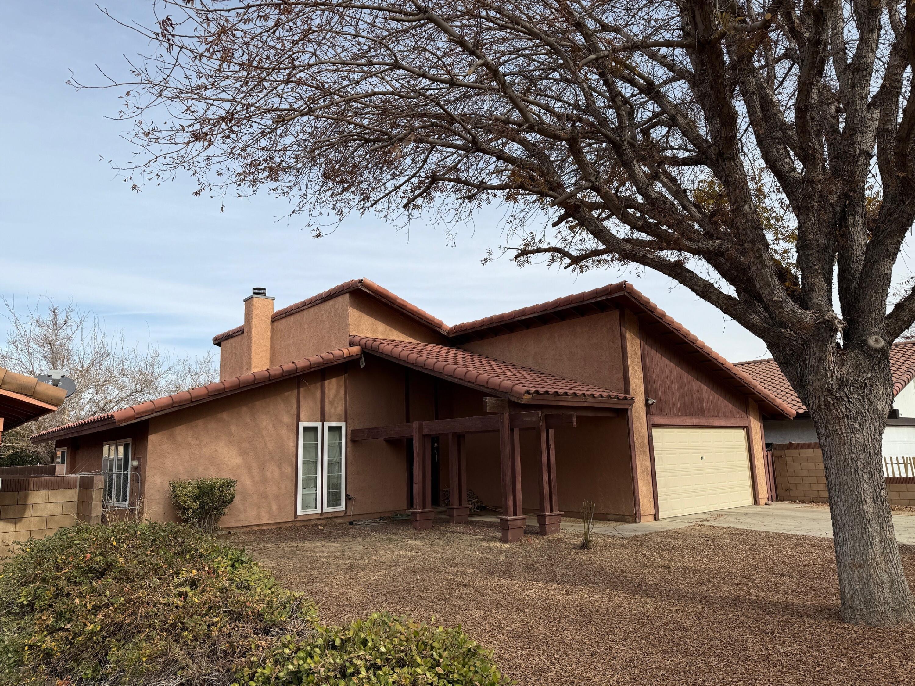 a house with trees in the background