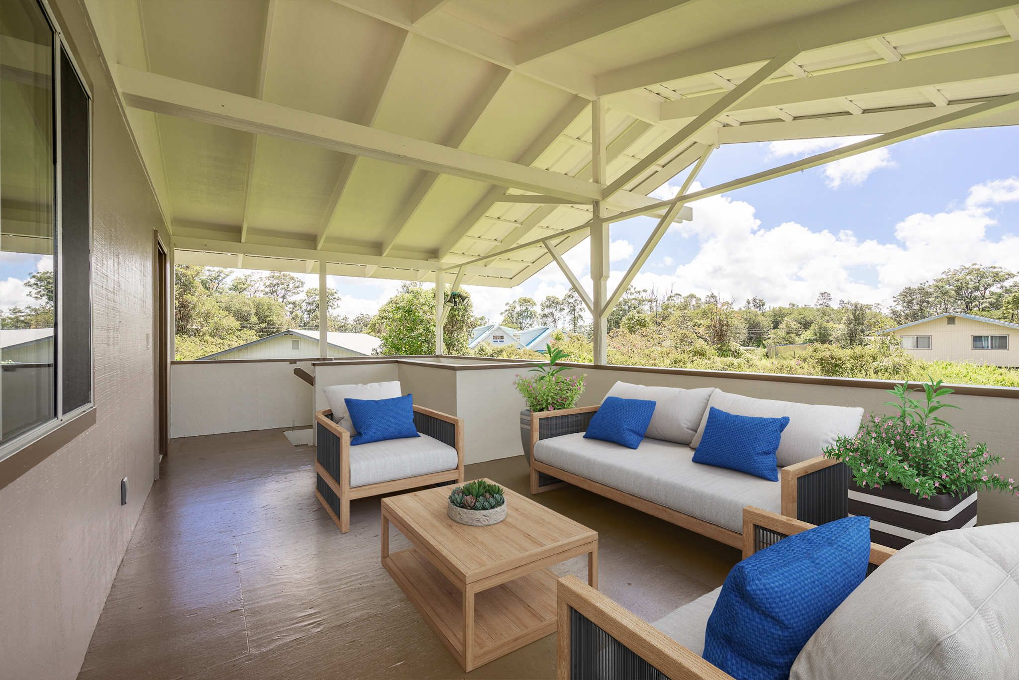 a outdoor sitting area with furniture and a floor to ceiling window