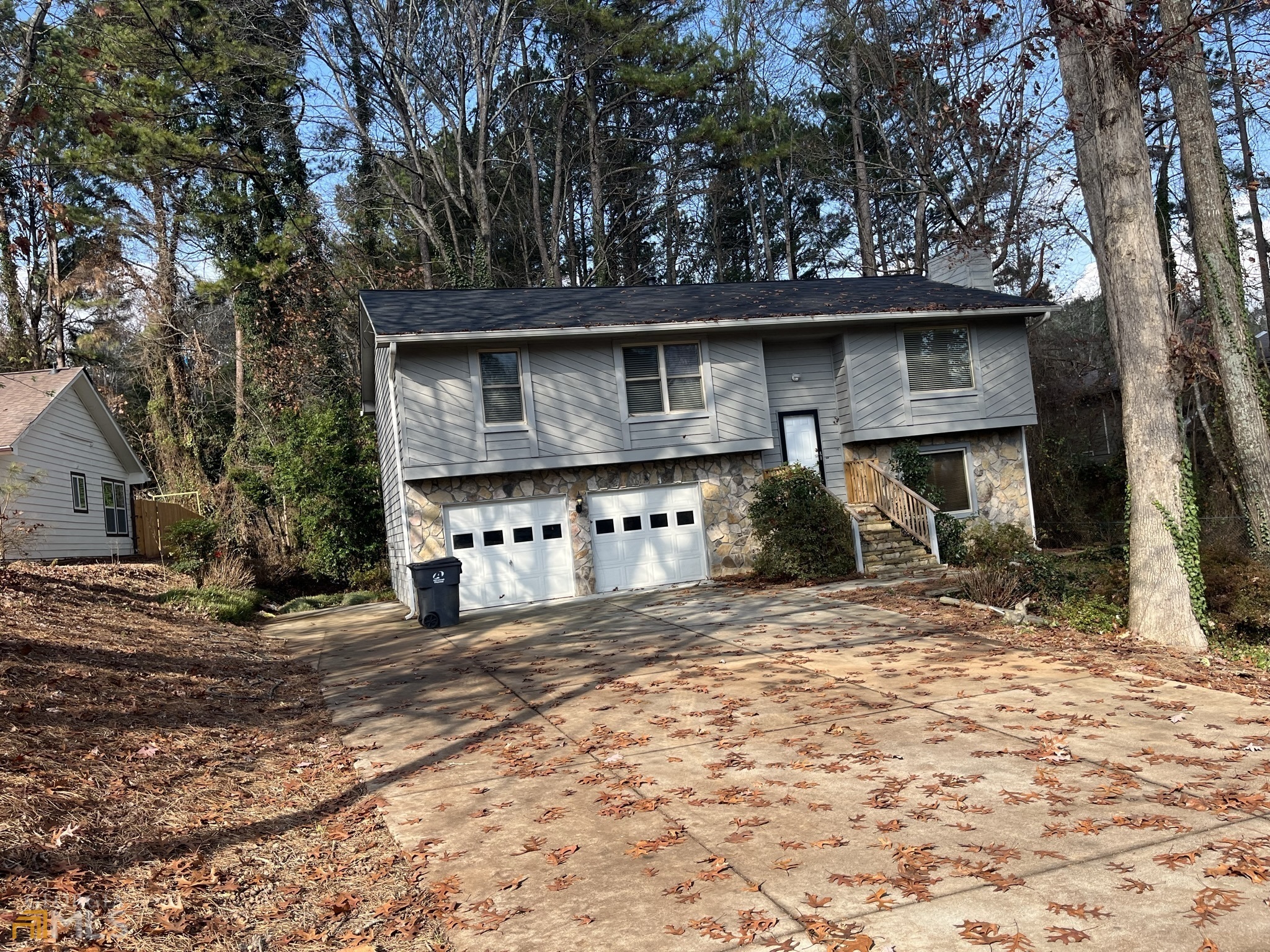 a house with trees in the background