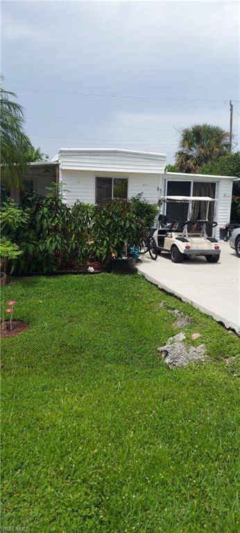 a view of a backyard with sitting area