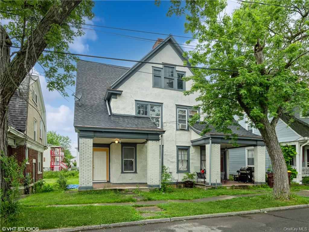 a front view of a house with a yard