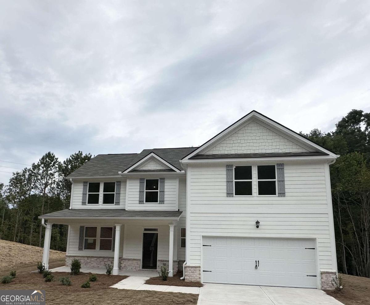 a front view of a house with a garage