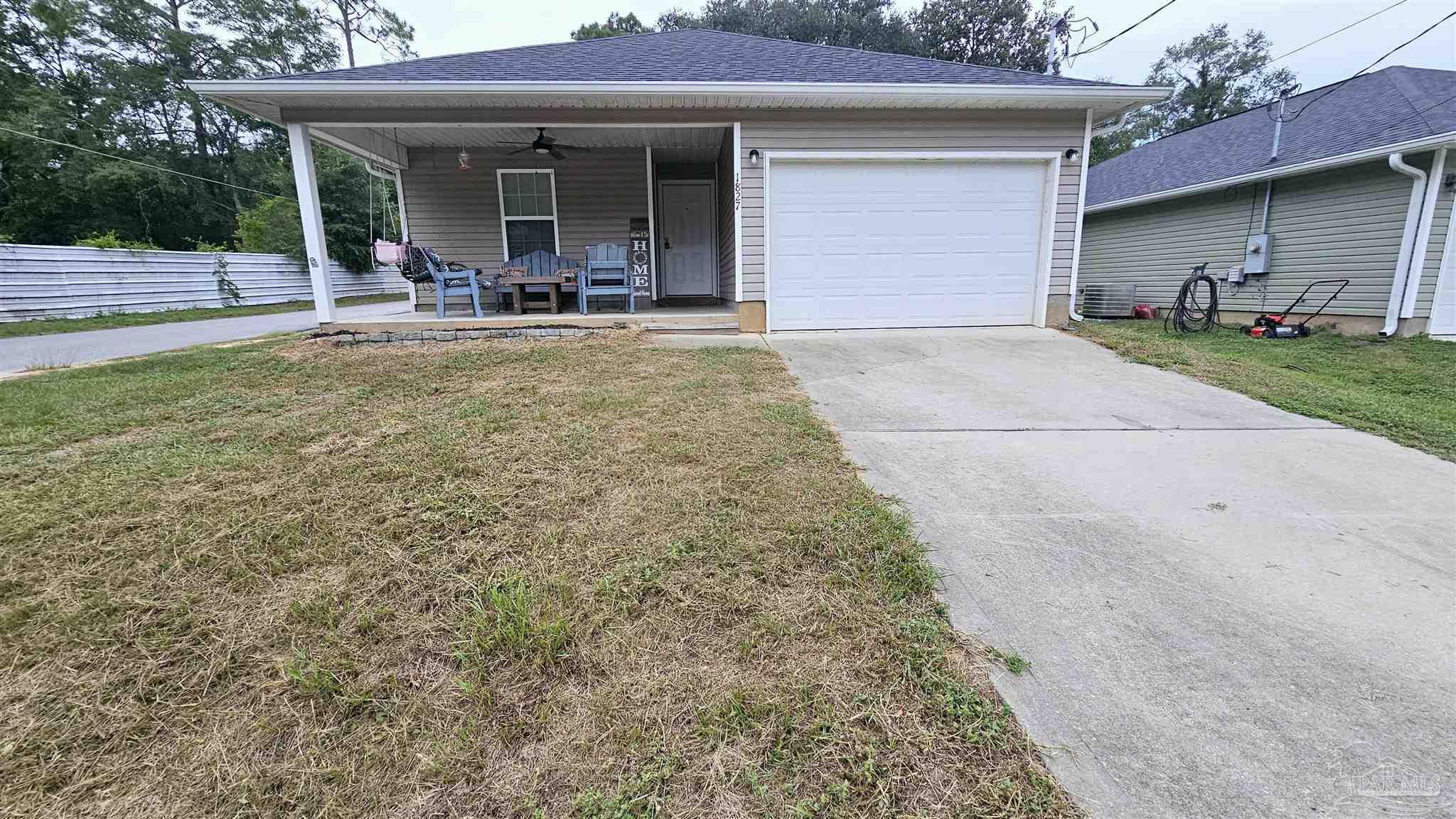 a front view of a house with garden and porch