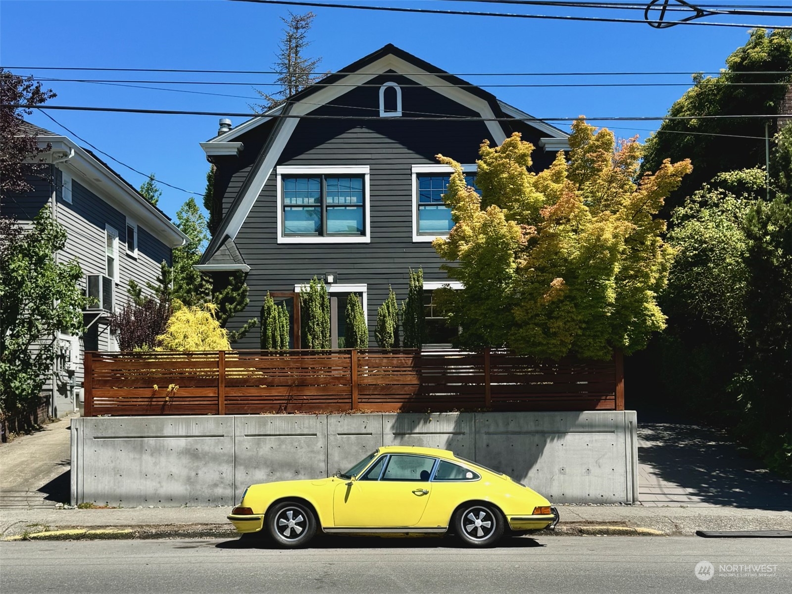 a view of a car parked in front of a house