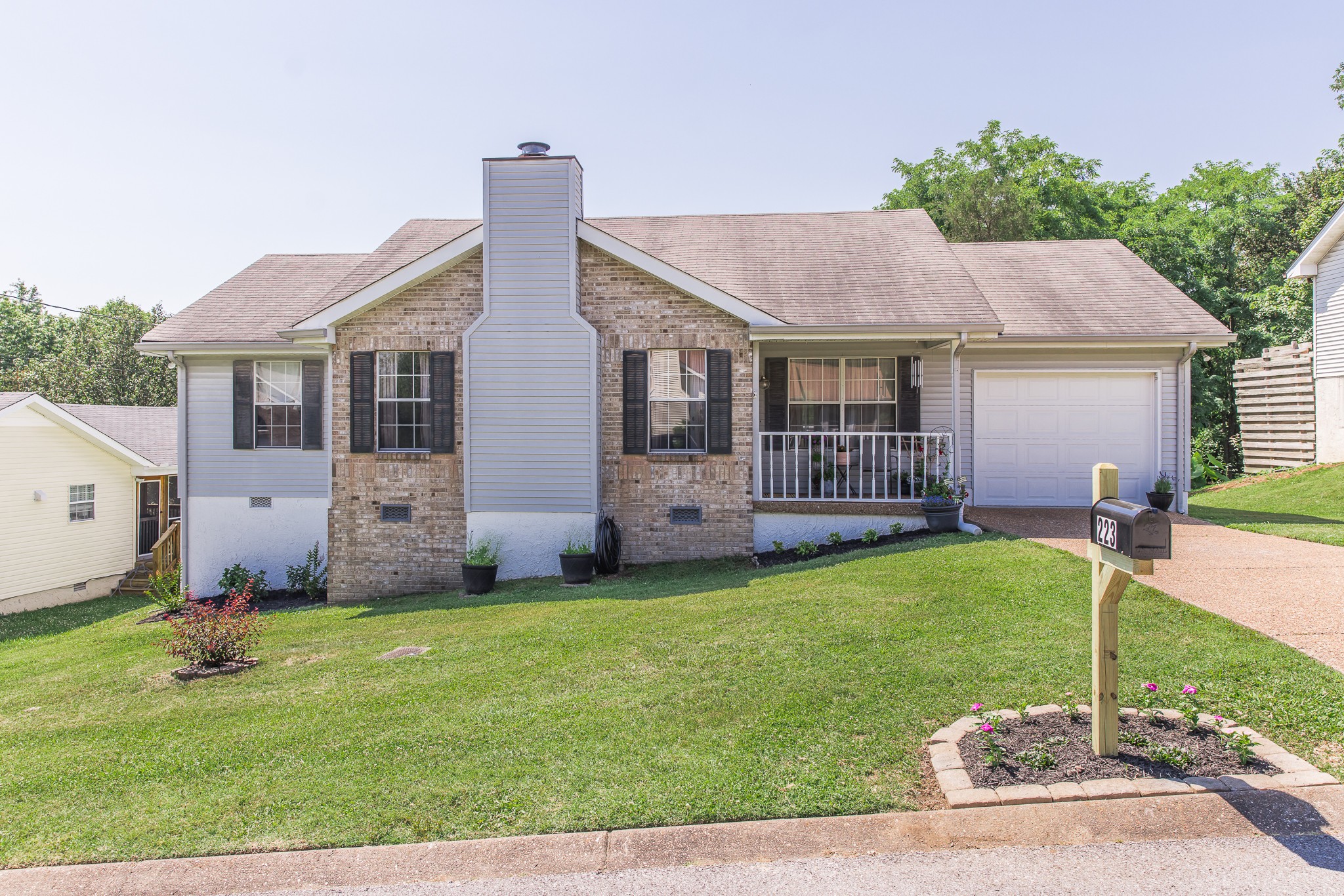 a front view of a house with garden