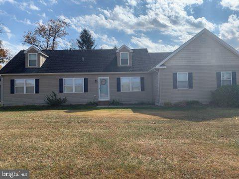 a view of a house with a backyard