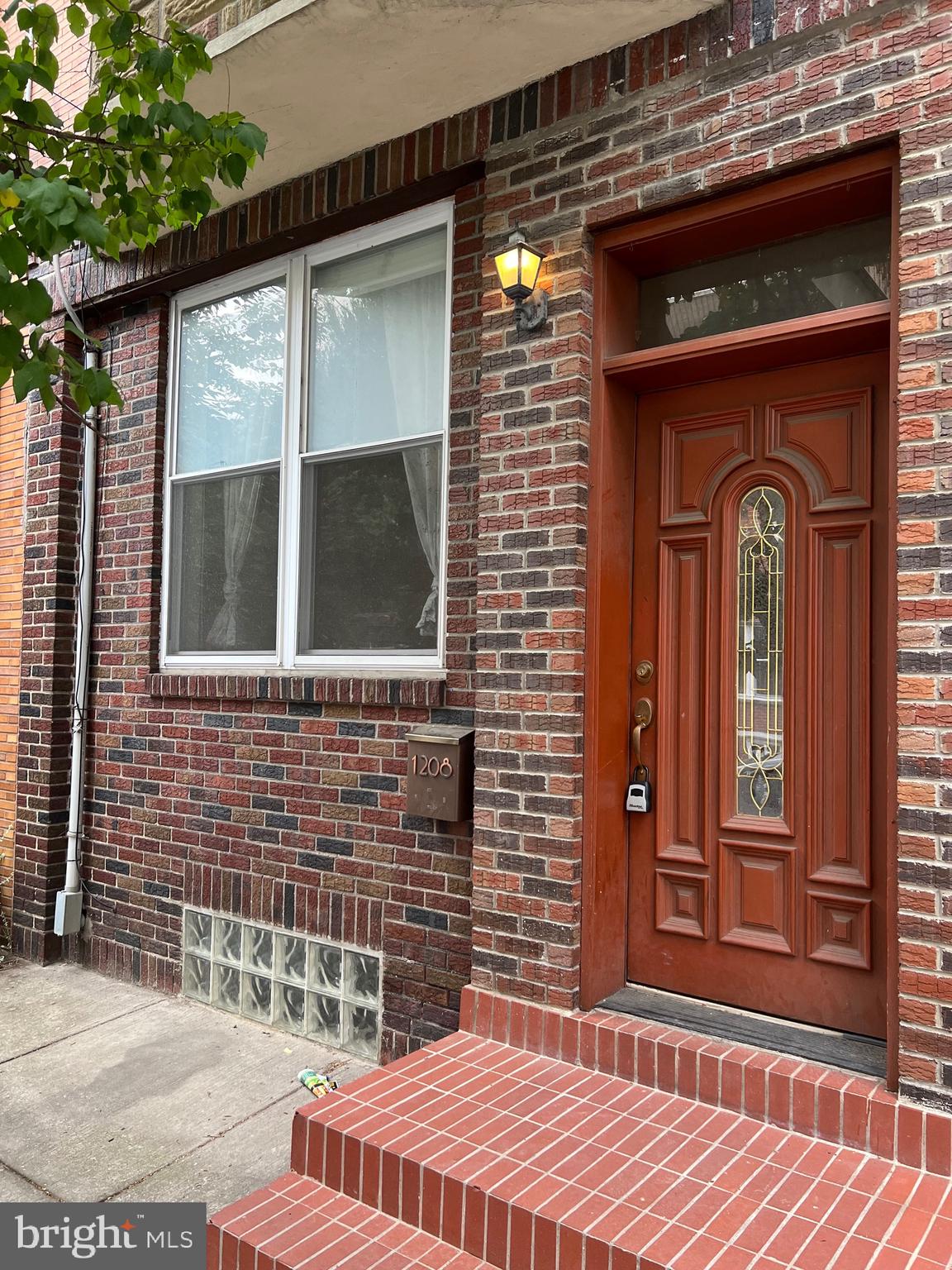 a front view of a house with a glass door