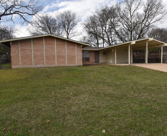 a house with trees in front of it