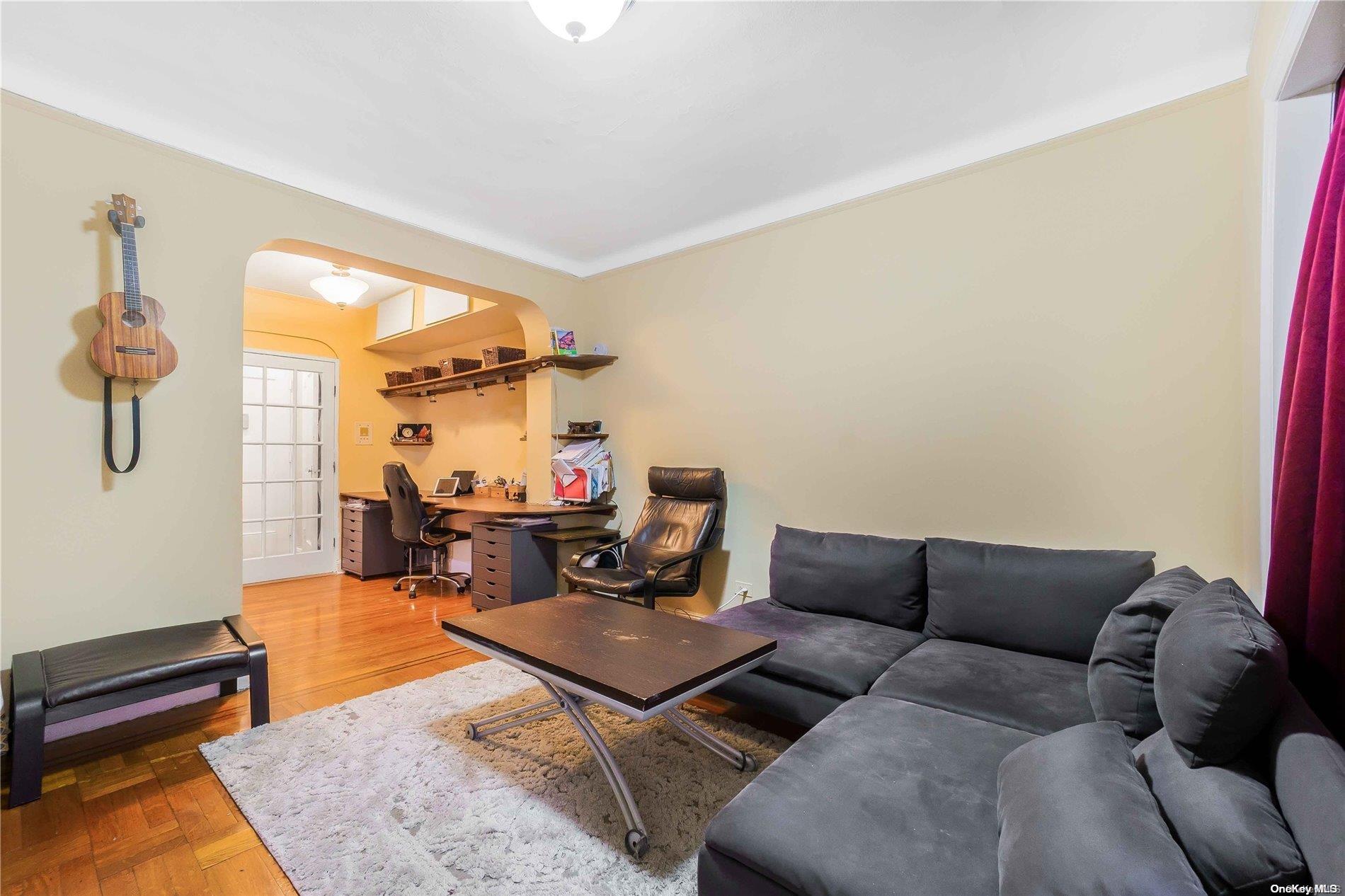 a living room with furniture and a rug