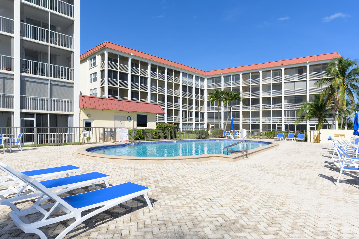 a view of pool with a outdoor seating