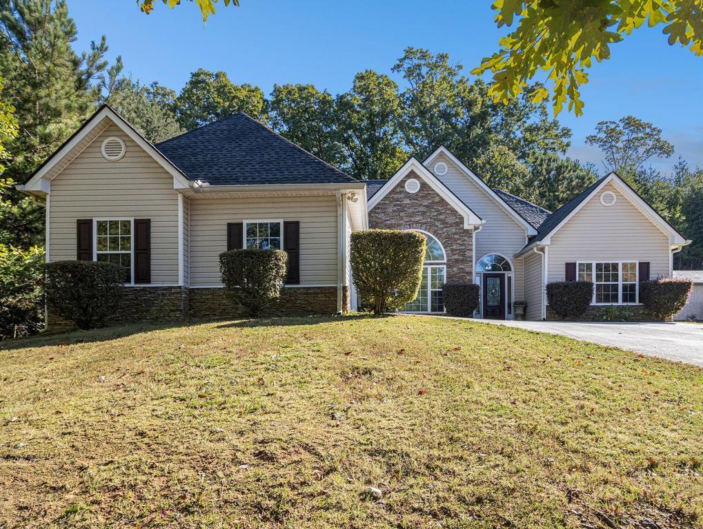 a front view of a house with a yard