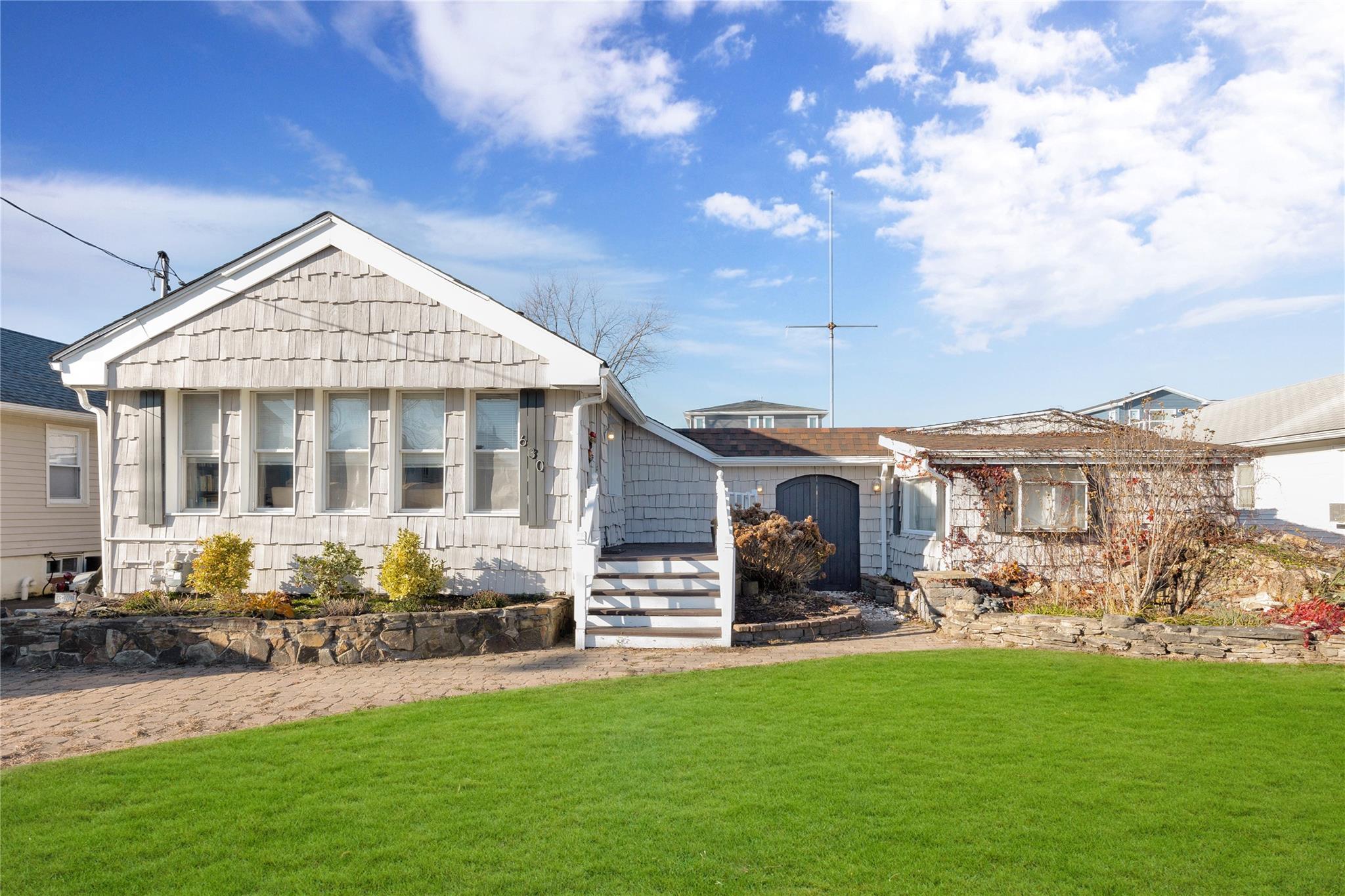 View of front of house featuring an Edited front lawn