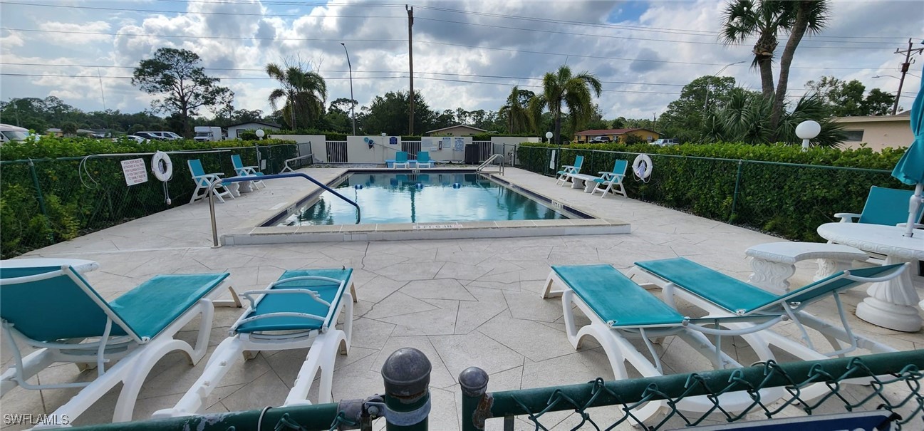 a view of yard with seating area and furniture