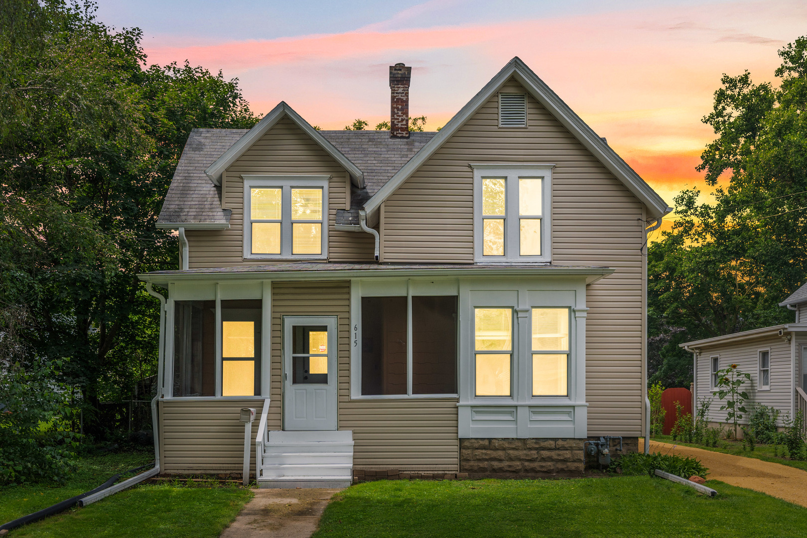 a front view of a house with garden