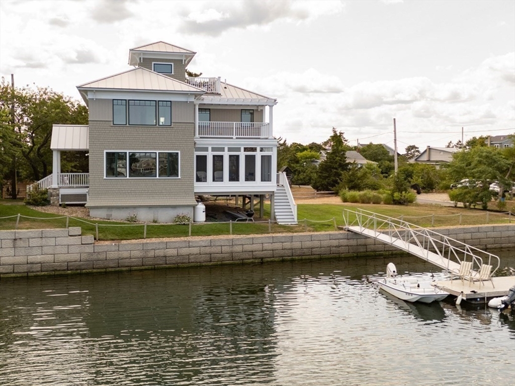 a view of house with swimming pool