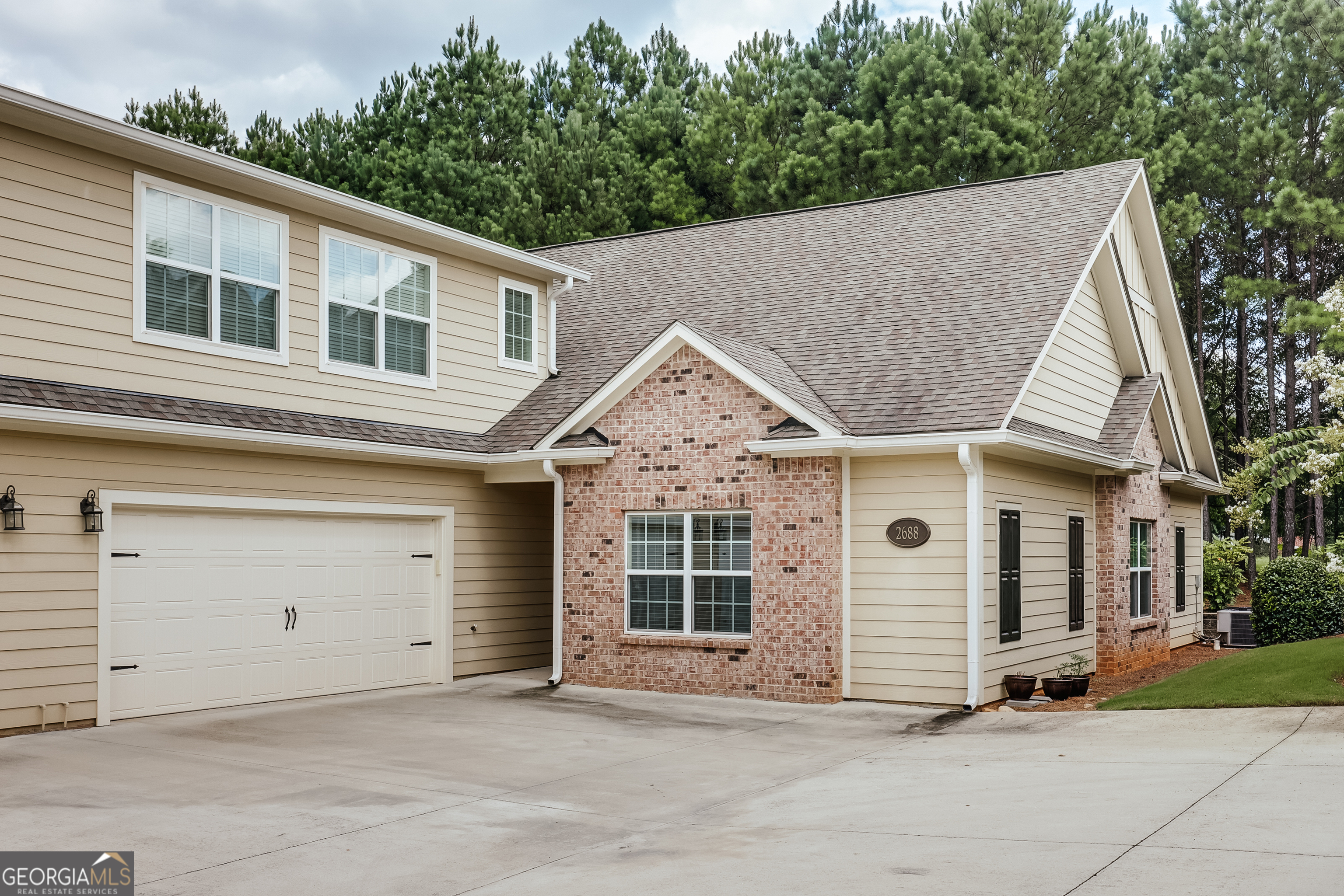 a view of a house with a garage