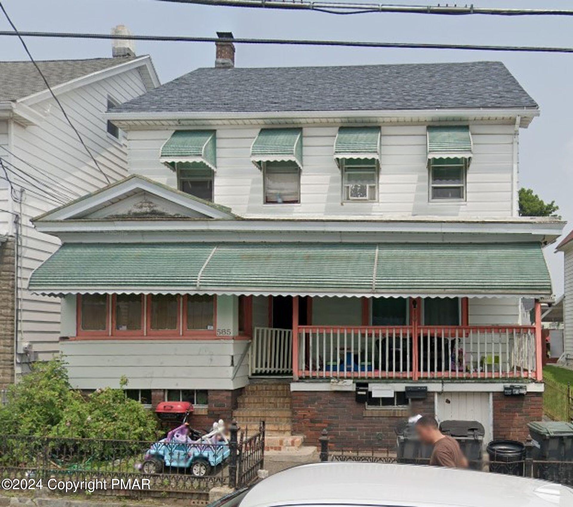 a front view of a house with balcony