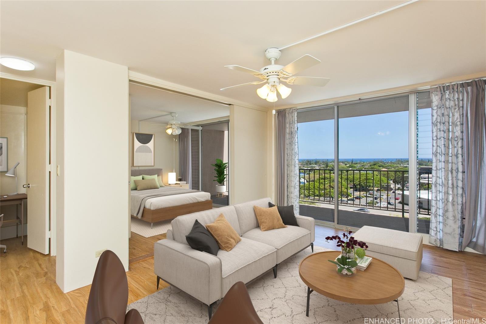 a living room with furniture and a large window