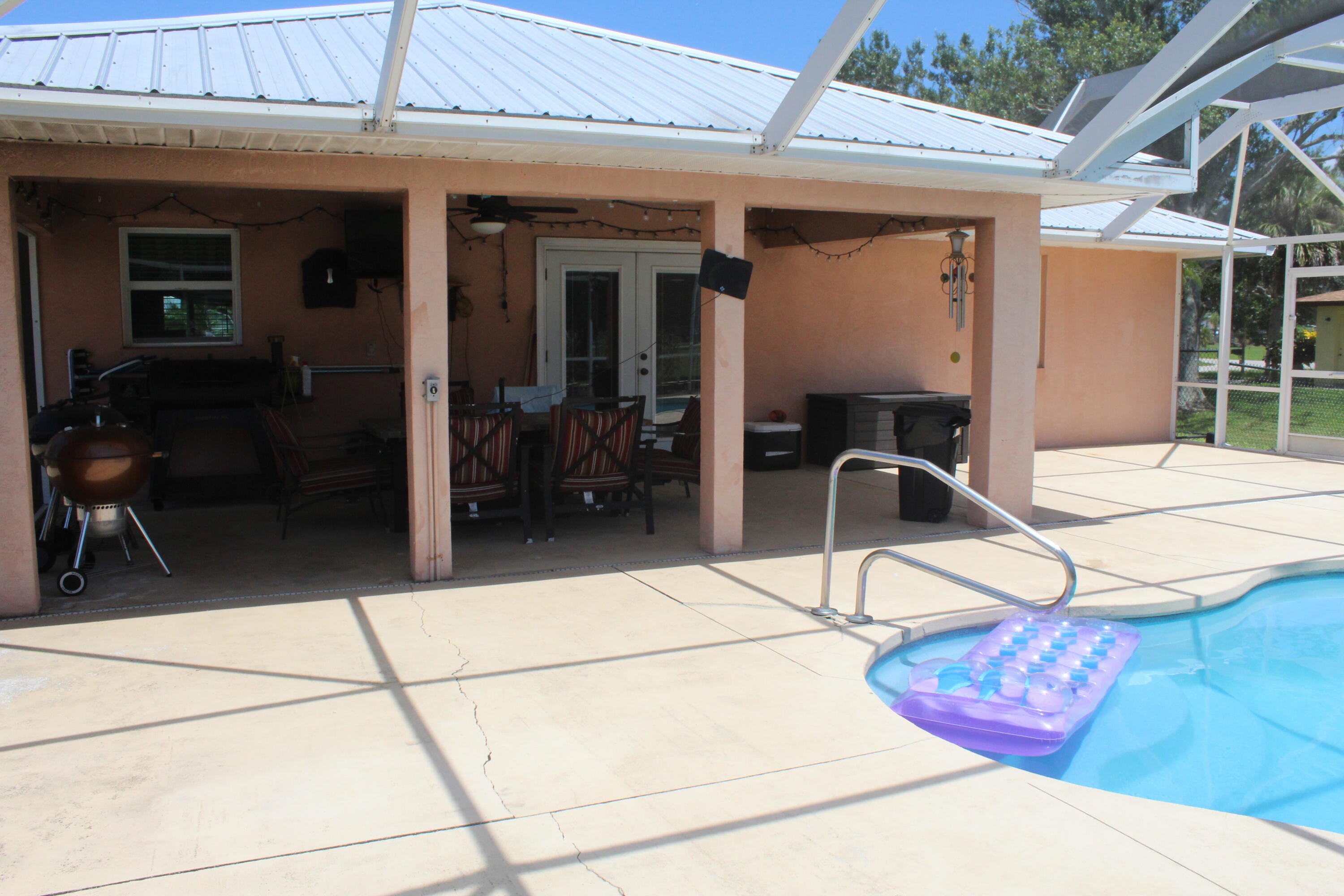 a building exterior with furniture and a rug