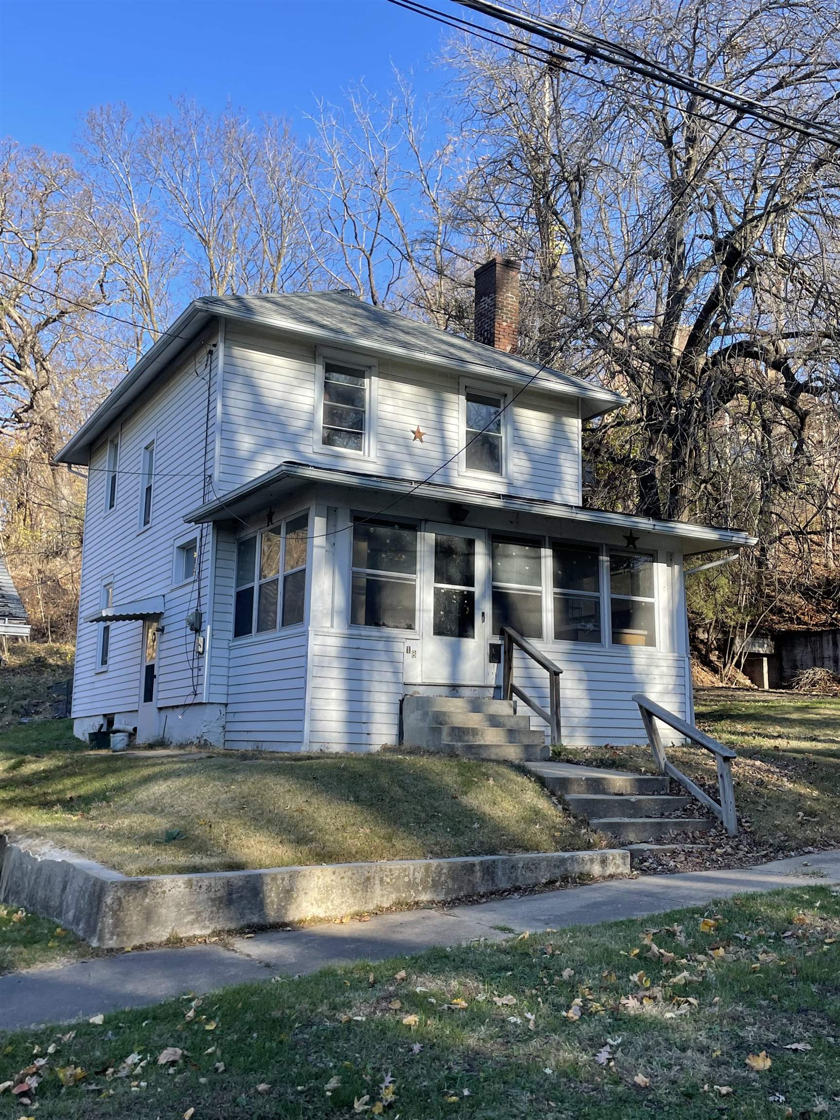 a view of a house with a yard balcony