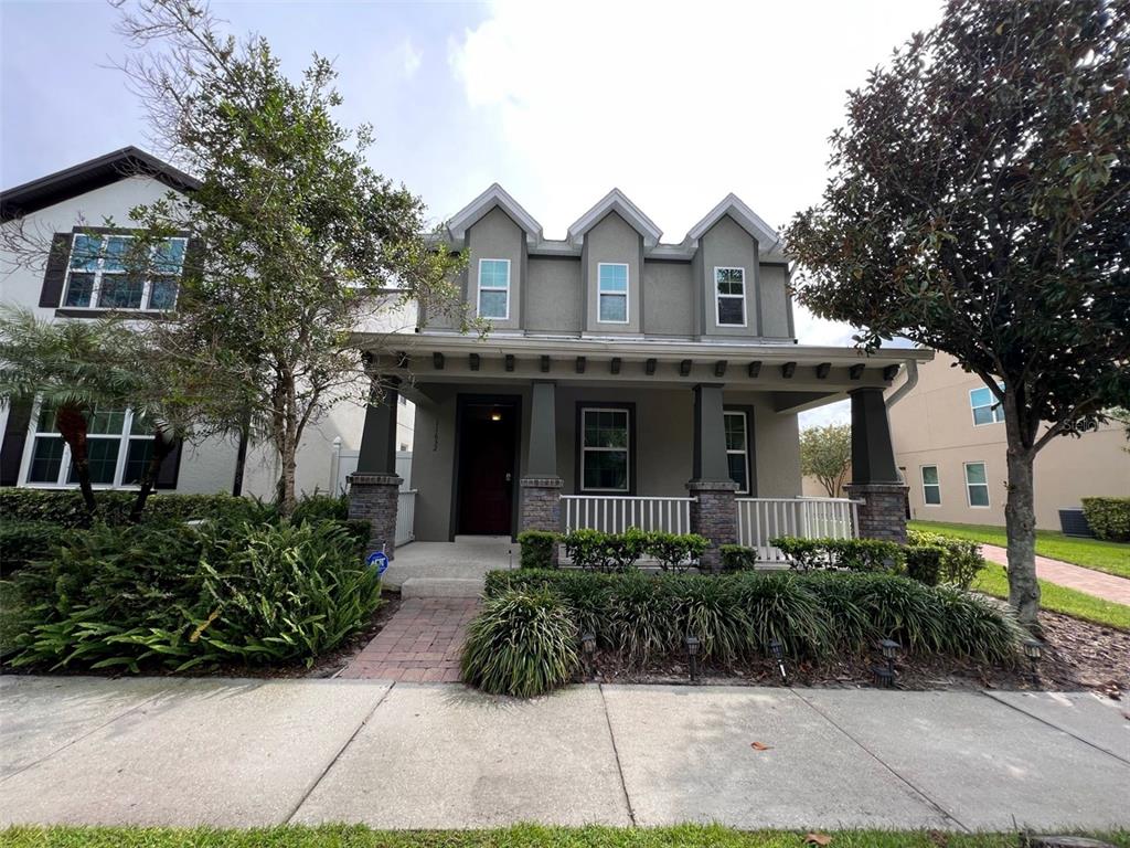 a front view of a house with garden