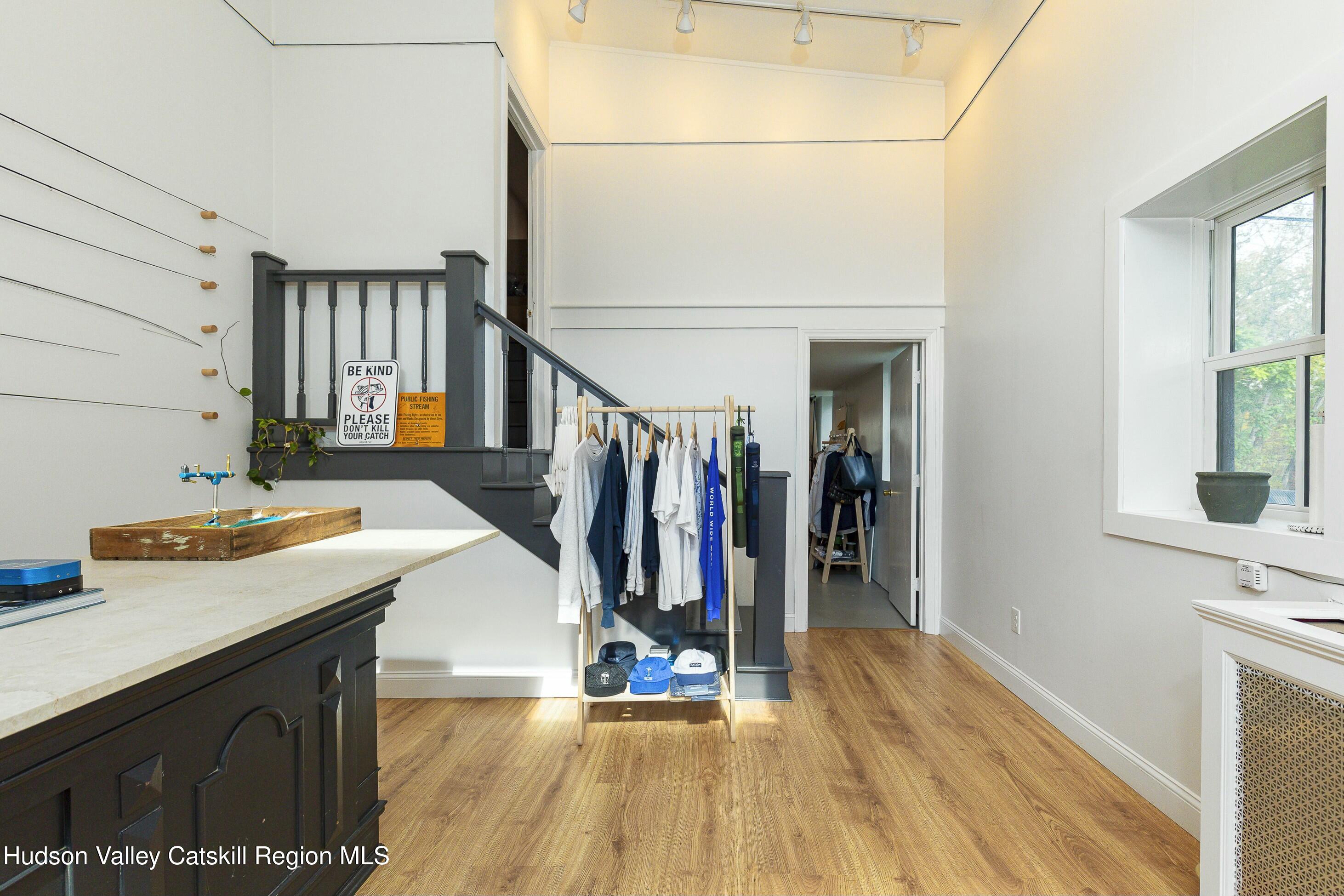 a hallway view with the view of living room