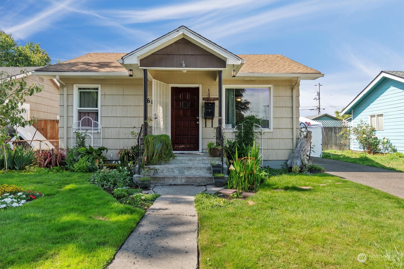 a front view of a house with a yard