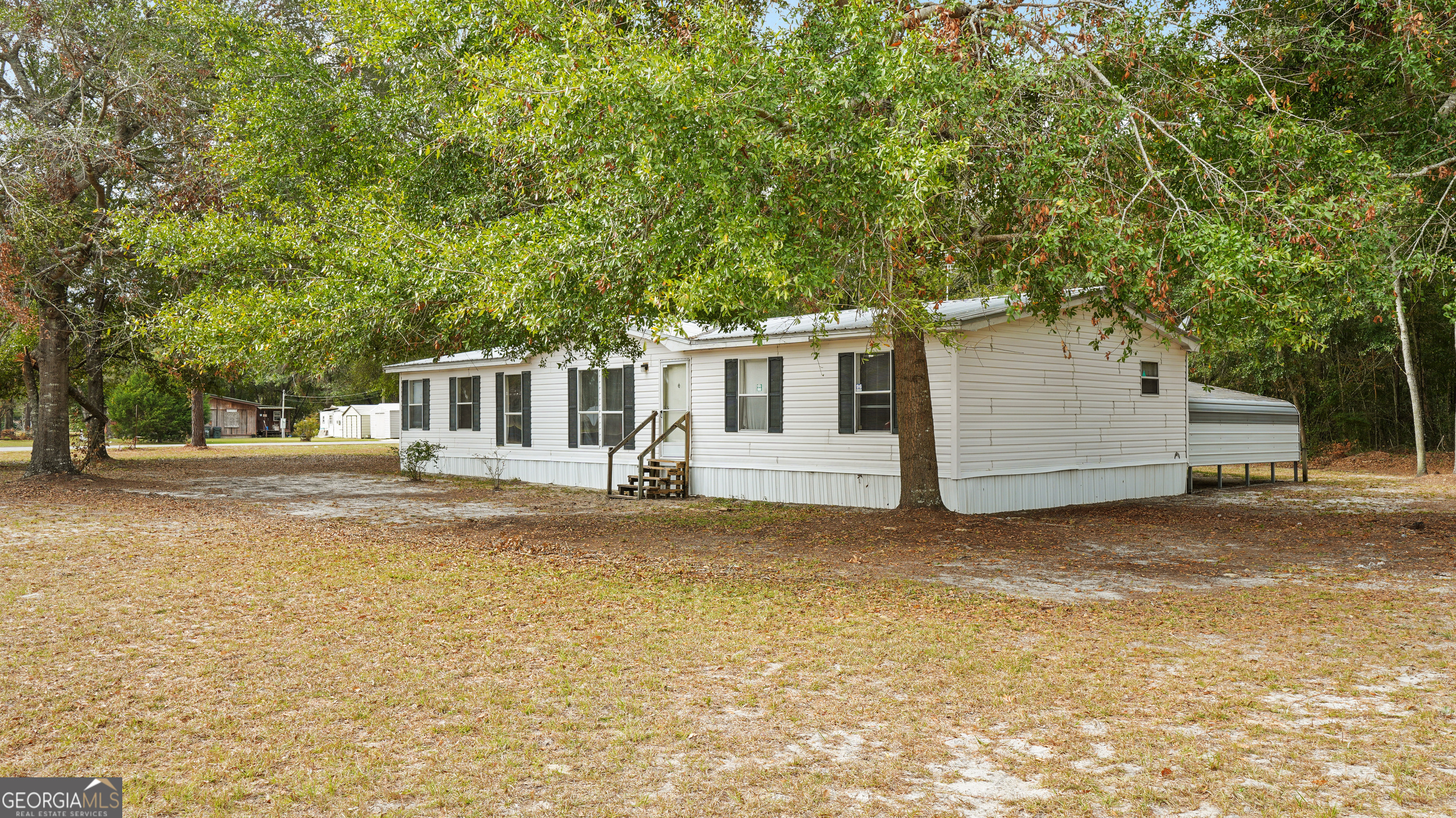 a view of a house with a yard