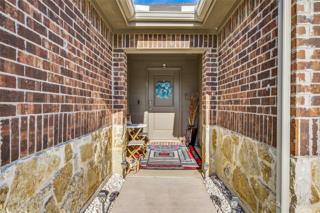 a view of front door with outdoor seating